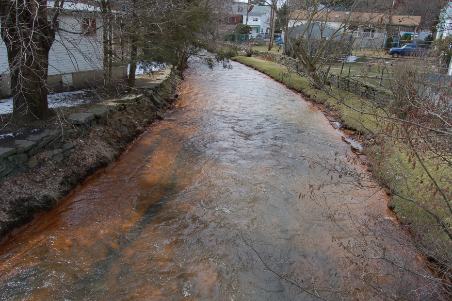 Photo of the orange Mahanoy Creek in Girardville, PA.