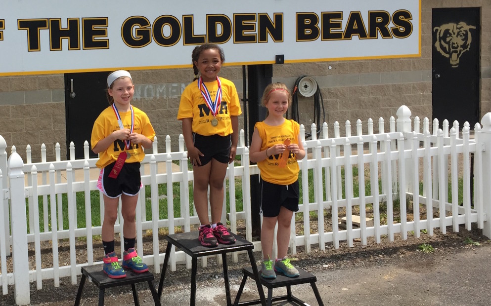Photo of Girls K-1st-2nd grade 100 meter dash winners: 1st Nevaeh Kennedy, 2nd Carley Hasara, 3rd Carly Honus.